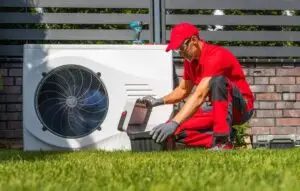 Technician On Replacement HVAC For Wichita Home With Action Heating And Cooling