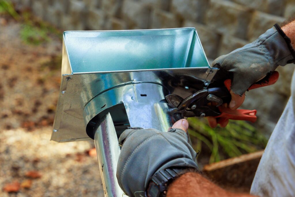 Technician inspecting noisy HVAC system in Wichita Homes